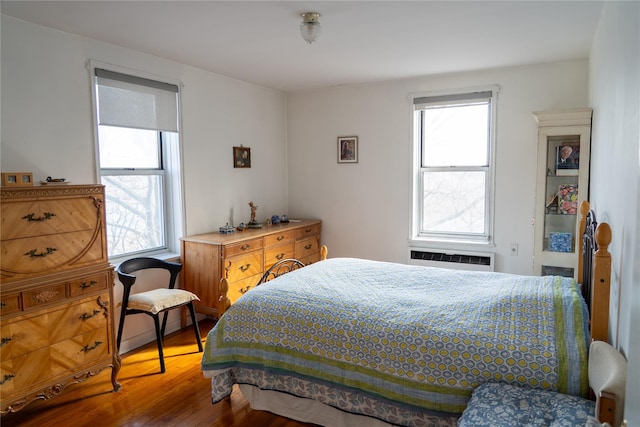 bedroom with wood finished floors