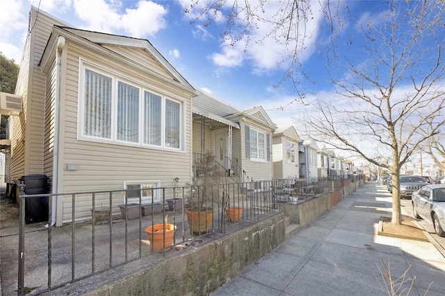 view of front of property featuring a residential view and a fenced front yard