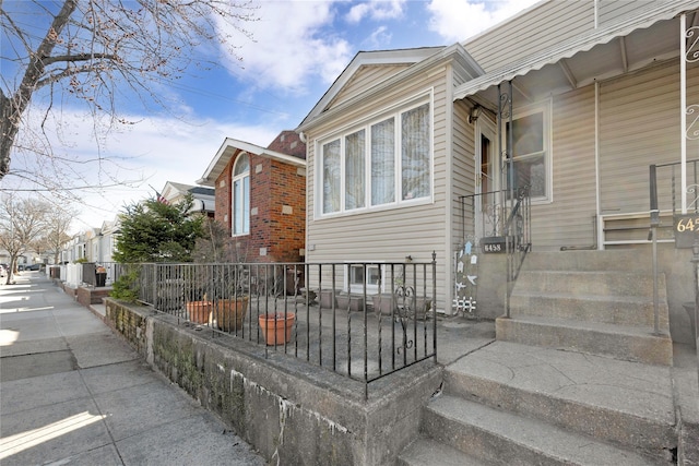 view of property exterior with fence