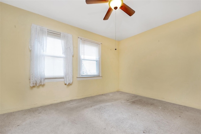 unfurnished room featuring carpet floors and ceiling fan