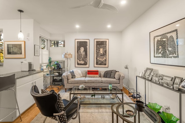 living room with light wood-style flooring, recessed lighting, and a ceiling fan