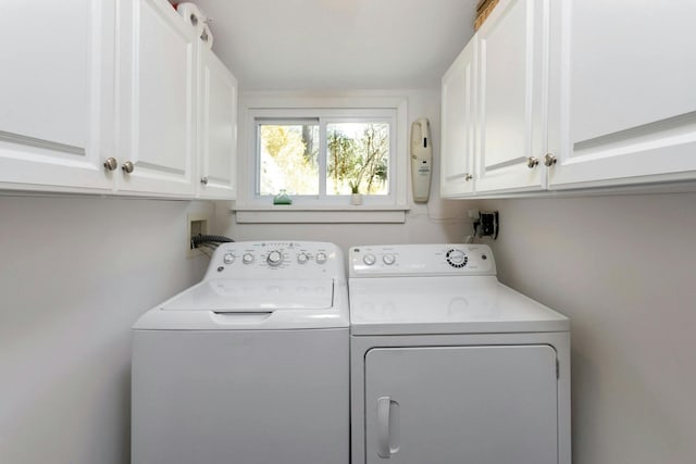 laundry room with washer and dryer and cabinet space