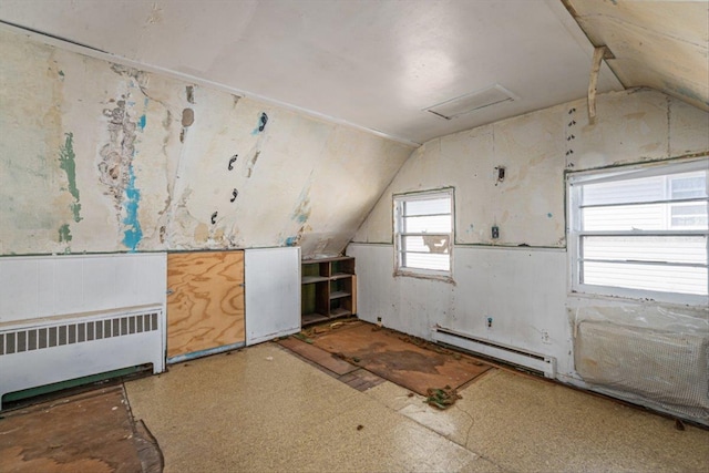 bonus room featuring a baseboard radiator, attic access, radiator heating unit, and vaulted ceiling