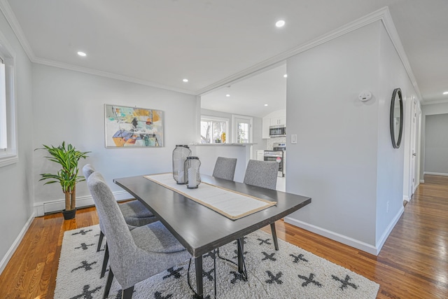 office with recessed lighting, ornamental molding, baseboards, and wood finished floors