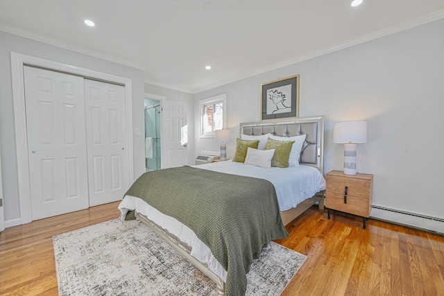 bedroom with light wood-style flooring, recessed lighting, a closet, crown molding, and baseboard heating