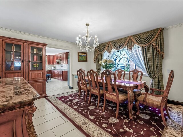 dining room featuring light tile patterned floors and a chandelier