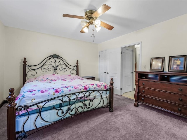 bedroom featuring ceiling fan and carpet flooring