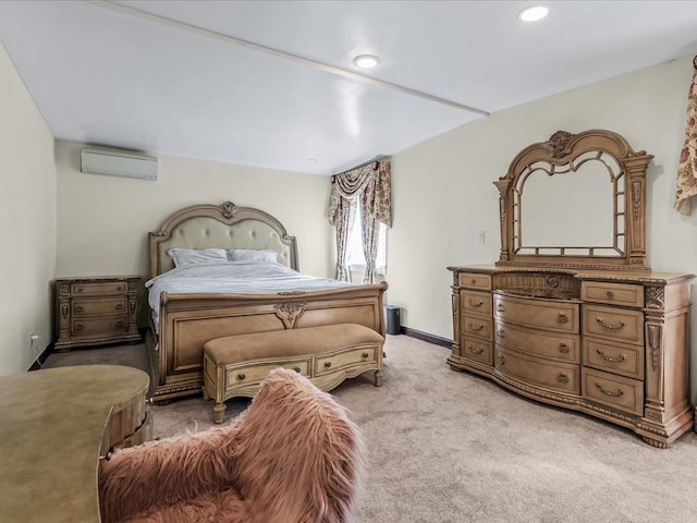 bedroom with recessed lighting, light colored carpet, baseboards, and a wall unit AC