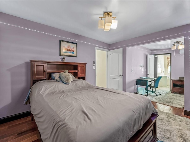 bedroom featuring wood finished floors