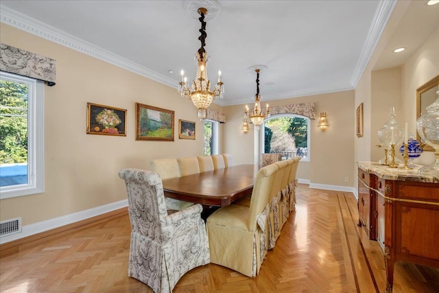 dining room with an inviting chandelier, ornamental molding, visible vents, recessed lighting, and baseboards