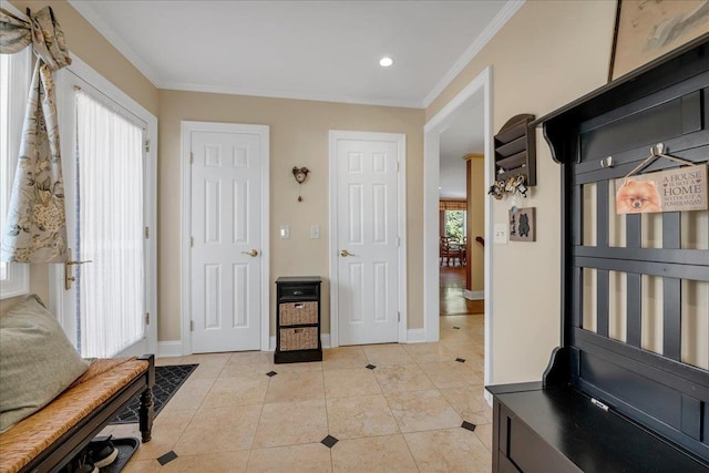 mudroom with crown molding, light tile patterned floors, baseboards, and recessed lighting