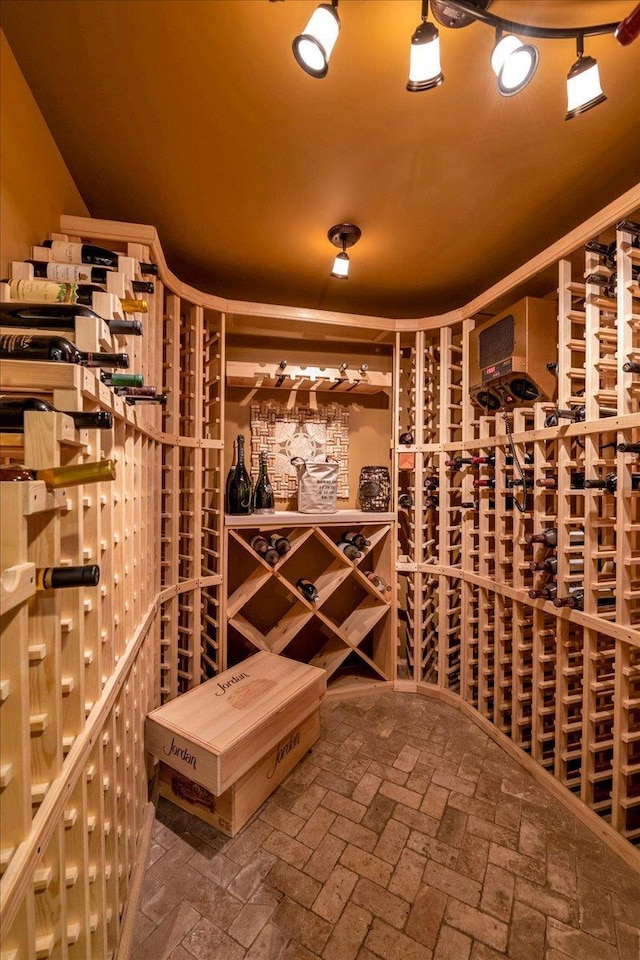 wine cellar featuring brick floor