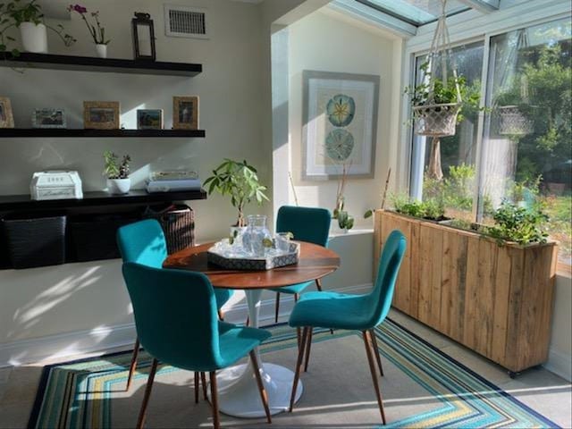 dining space featuring visible vents