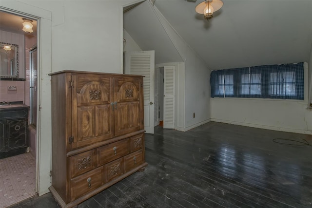 bedroom with dark wood-style flooring