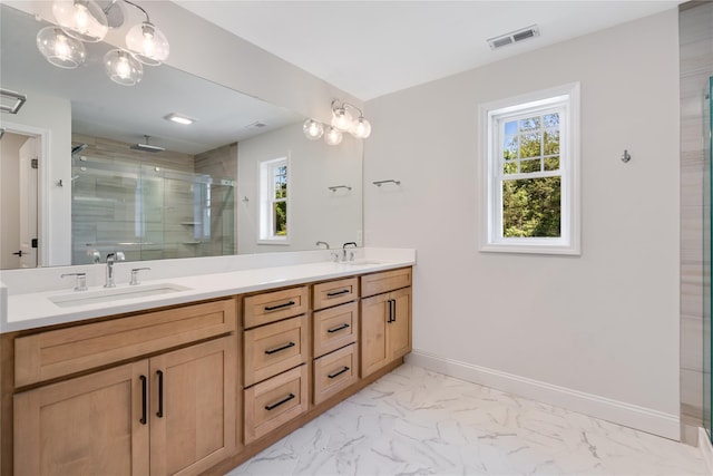 full bathroom with visible vents, baseboards, a sink, a shower stall, and marble finish floor