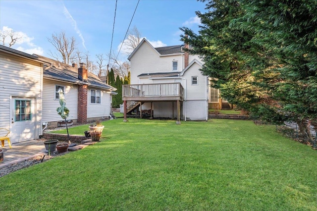 view of yard featuring stairs and a deck