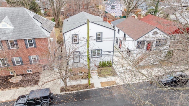 birds eye view of property with a residential view