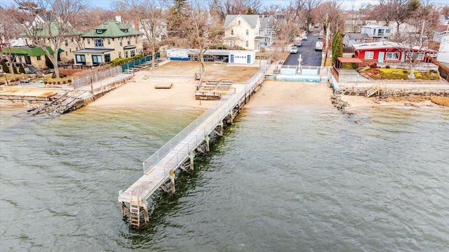 dock area featuring a residential view and a water view