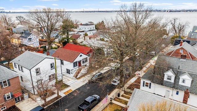 birds eye view of property featuring a residential view and a water view