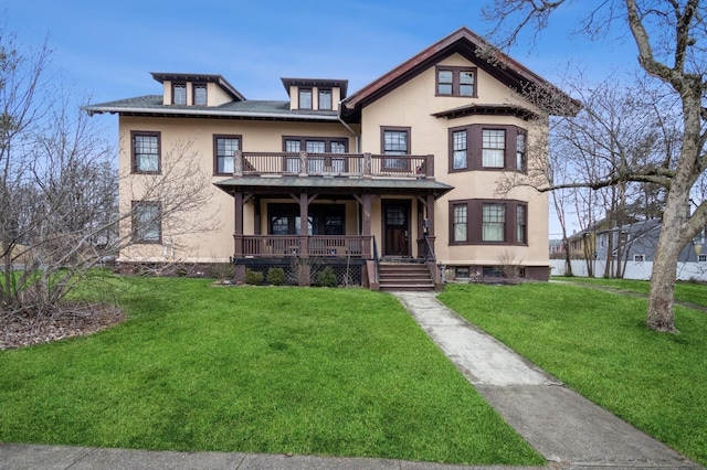 view of front facade featuring stucco siding, a balcony, covered porch, and a front lawn