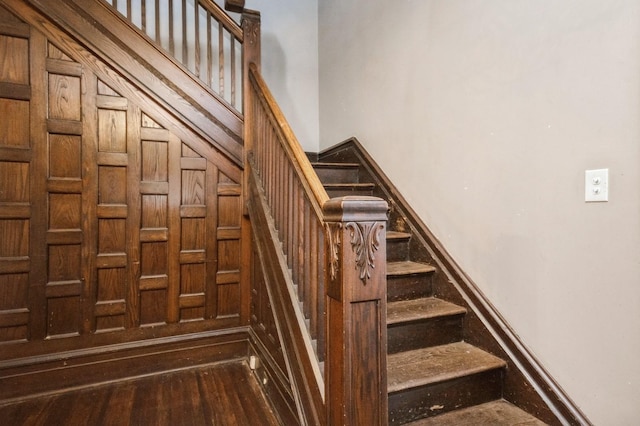 staircase with wood finished floors