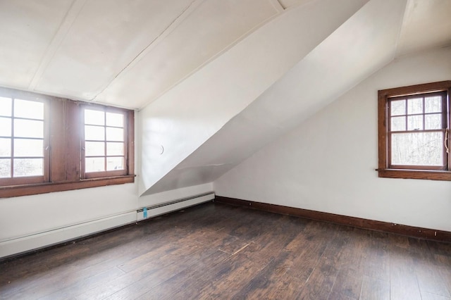 bonus room with vaulted ceiling, dark wood-type flooring, baseboards, and a baseboard radiator