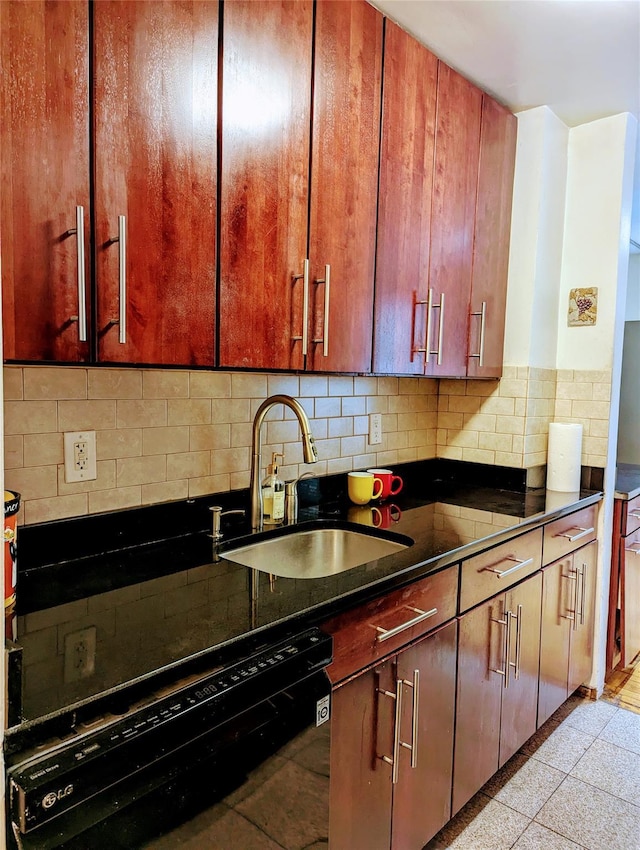 kitchen with a sink, decorative backsplash, black dishwasher, and dark countertops