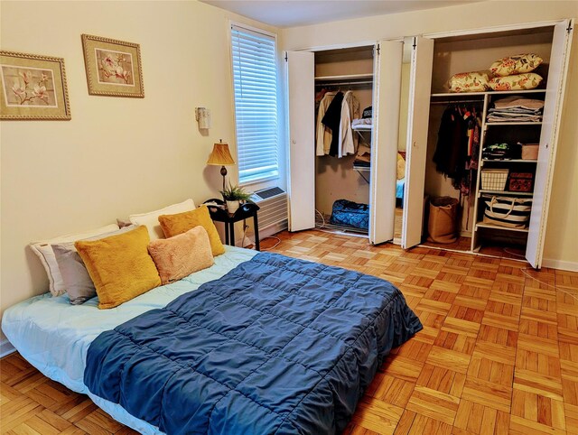 bedroom featuring two closets