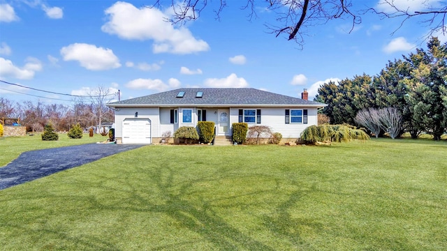 ranch-style house with a chimney, driveway, a front lawn, and a garage