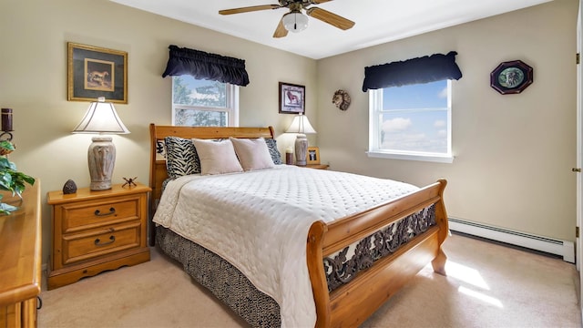 bedroom with ceiling fan, light colored carpet, and a baseboard radiator