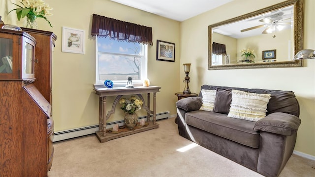 sitting room featuring baseboards, carpet, a baseboard radiator, and ceiling fan