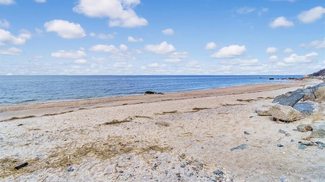 view of water feature with a beach view