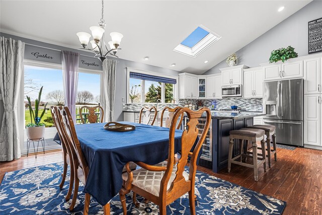 2100 Duck Pond Rd, Cutchogue, NY 11935 - dining area with lofted ceiling, a skylight, dark wood-type flooring, a chandelier, and recessed lighting