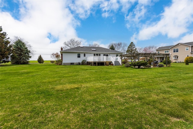 2100 Duck Pond Rd, Cutchogue, NY 11935 - back of house featuring a pergola, a lawn, and a wooden deck
