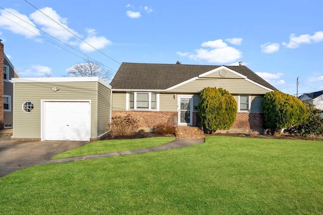 ranch-style home featuring driveway, a front lawn, roof with shingles, a garage, and brick siding