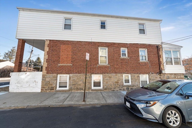 exterior space featuring brick siding