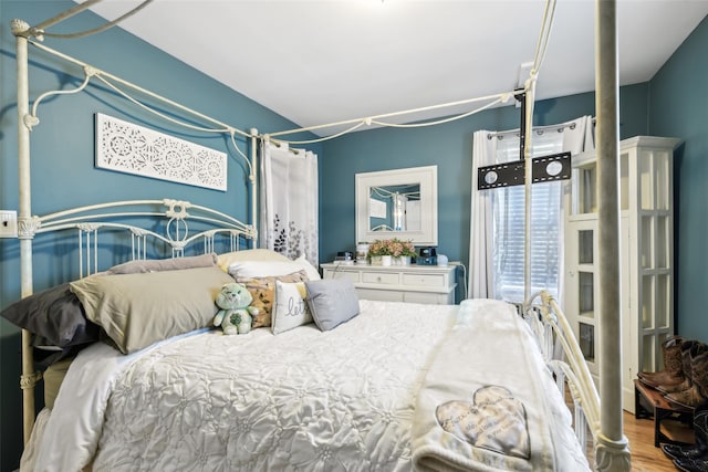 bedroom with wood finished floors