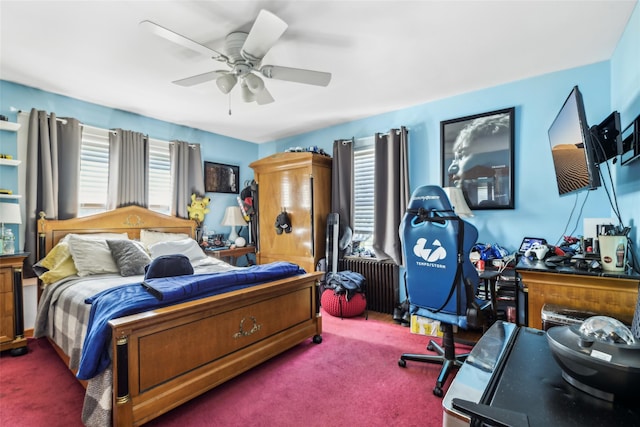 carpeted bedroom with radiator and ceiling fan