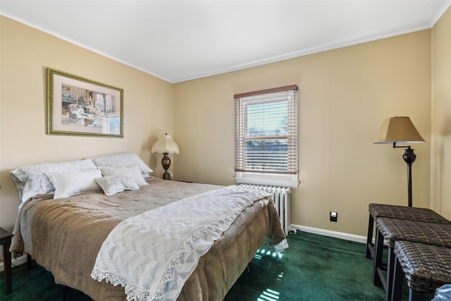 bedroom with carpet flooring, baseboards, radiator heating unit, and crown molding