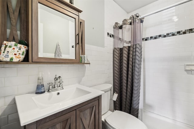 full bath featuring vanity, a shower stall, toilet, and tile walls