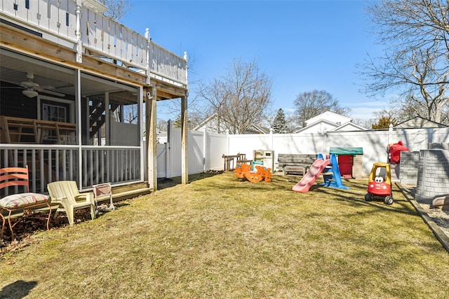 view of yard with a fenced backyard and a sunroom