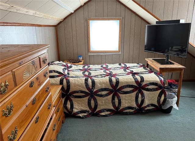 carpeted bedroom with wood walls and vaulted ceiling