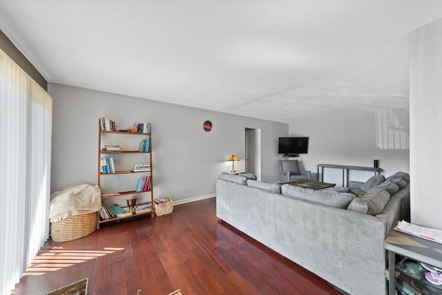 living room with baseboards and wood finished floors