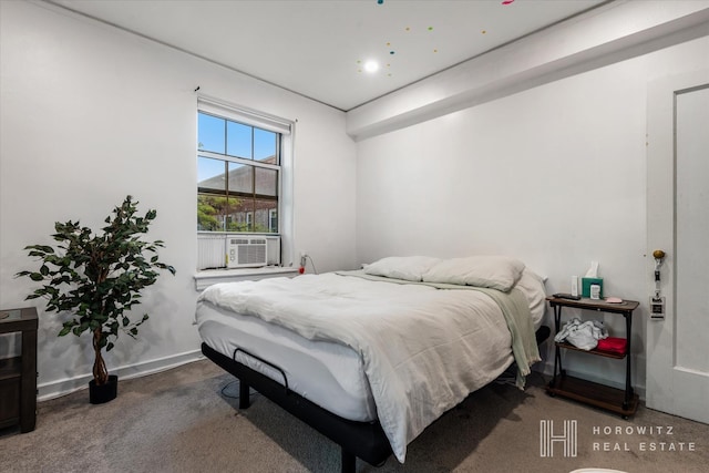 bedroom with cooling unit and baseboards