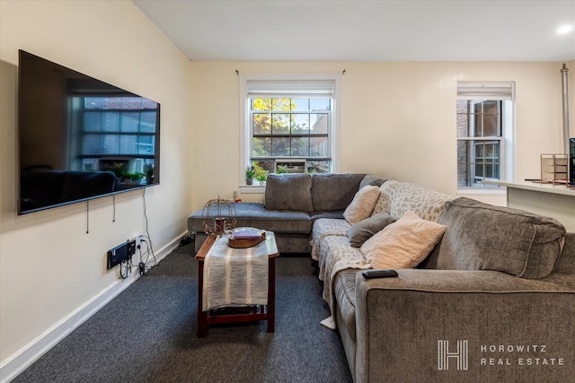 carpeted living area featuring baseboards