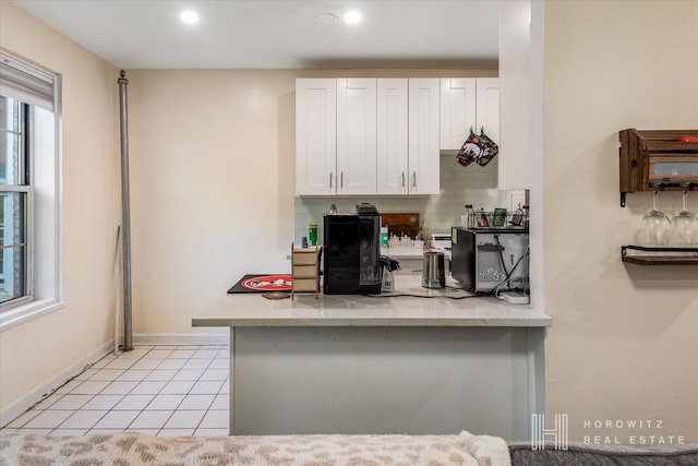 kitchen with light tile patterned floors, baseboards, recessed lighting, white cabinets, and tasteful backsplash