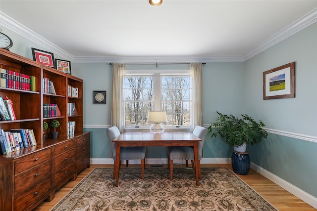 home office with baseboards, ornamental molding, and wood finished floors