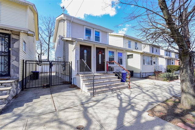 view of front of home featuring a gate