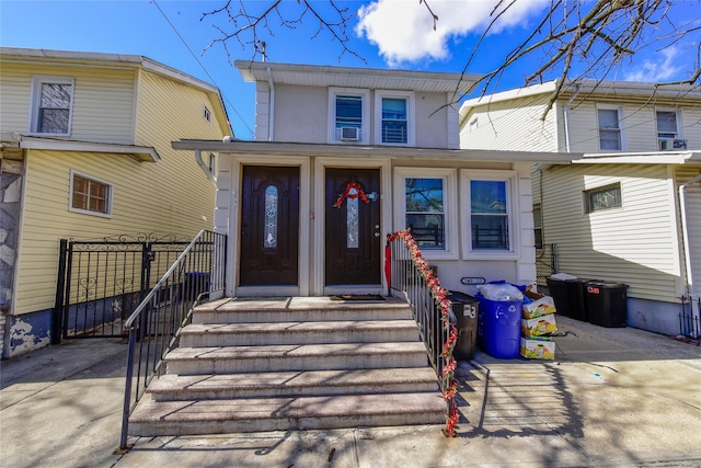 view of front of property with driveway and stucco siding