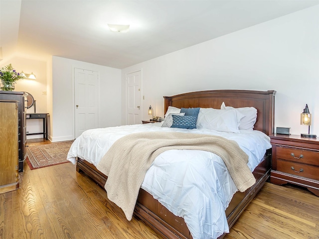 bedroom with wood finished floors